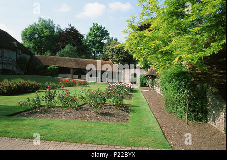 Lawns and old buildings in Manor Gardens, in the old town district of Bexhill-On-Sea, East Sussex, Southern England Stock Photo