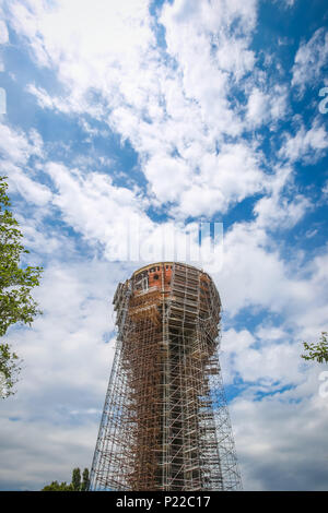 A low angle view of the Vukovar water tower under construction and intended to be a memorial place in Vukovar, Croatia. It is a symbol of the city suf Stock Photo