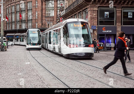 Strasbourg, France - December 28, 2017 : electric tram train of the Strasbourg public transport company (CTS) running on a street in the city on a winter day Stock Photo
