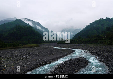 This is an image of a river on a gloomy cloudy afternoon in the hills of Arunchal Pradesh,India Stock Photo