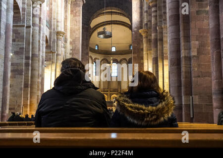 People praying in a church Stock Photo
