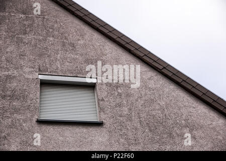 Window with closed shutters, security blinds Stock Photo