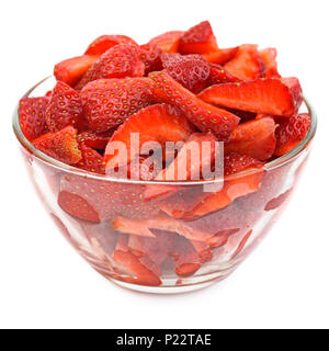 Preparation of strawberry jam. Fresh juicy strawberries in glass bowl. Chopped strawberries in transparent glas bowl isolated on white background. Hom Stock Photo