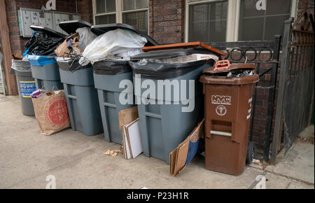 https://l450v.alamy.com/450v/p23h1r/overflowing-trash-cans-awaiting-pick-up-outside-of-an-apartment-building-in-the-greenpoint-neighborhood-of-brooklyn-in-new-york-on-sunday-june-3-2018-richard-b-levine-p23h1r.jpg