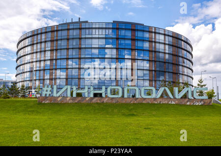 Innopolis, Russia - June 11, 2018: Modern building in It-village in Kazan district.  Inscription 'Innopolis' in big letters on the ground. Innopolis c Stock Photo