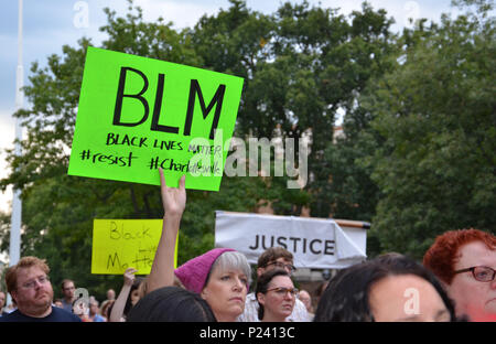 ANN ARBOR, MI - AUG 13: A woman holds up a sign at a rally in solidarity with the counter-protesters of Charlottesville in Ann Arbor, MI on August 13, Stock Photo