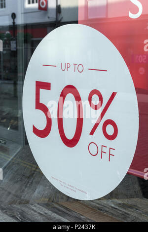 Summer sales sign in Truro (Cornwall) shop window. Metaphor high street squeeze, retail squeeze. Stock Photo