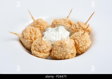 Snack for beer - deep fried cheese balls with sauce. Stock Photo