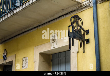 Advertising sign on a upholstery in Narbonne Stock Photo