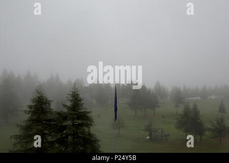 Riederalp, Switzerland, View over a golf course in fog Stock Photo