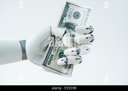 close-up view of robot holding dollar banknotes isolated on white Stock Photo