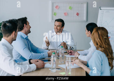 business colleagues having discussion at workplace in office Stock Photo