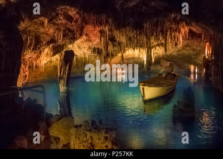 Drach cave of Mallorca island with traditional boat on small lake, Spain Stock Photo