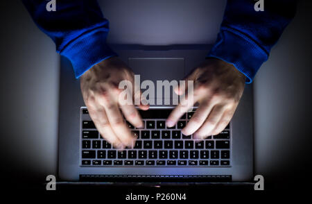 Cybercrime, a laptop hacker, writes codes to access unauthorized things, an illegal way, hacker, crime, cyber Stock Photo