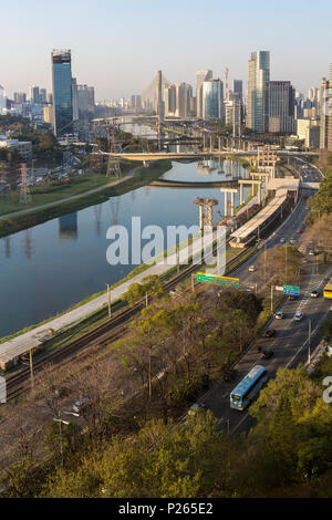 Aerial view of the 'Marginal Pinheiros' Avenue, Pinheiros River and skyline of Sao Paulo city on a sunny summer day. Stock Photo