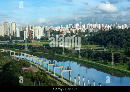 View of the 'Marginal Pinheiros' Avenue, Pinheiros River and skyline of Sao Paulo city on sunny summer day. Stock Photo