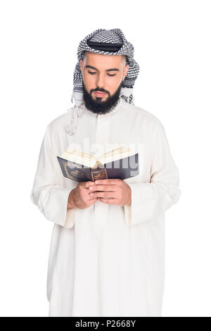 handsome muslim man reading quran isolated on white Stock Photo