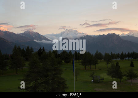 Riederalp, Switzerland, View over a golf course at dawn Stock Photo