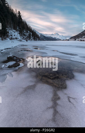 Piz Da La Margna seen from the frozen Lake Champfer, Silvaplana, Maloja Region, canton of Graubunden, Engadin, Switzerland Stock Photo