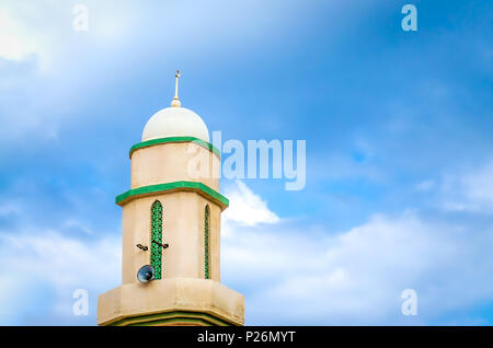 Majestic Minaret with Loudspeakers with Blue Sky in the background. Muscat, Oman. Stock Photo