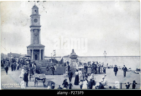 . Postcard of the Clock Tower and Portland stone drinking fountain given to the town in 1888 by London Alderman Col. Horatio Davies, who became Lord Mayor of London. The drinking fountain is now in a sunken garden opposite Telford Terrace on the sea front. The third Herne Bay Pier is in the background. Points of interest  The photo can be dated between 1899 and 1909 because the third Herne Bay Pier has been built but Grand Pier Pavilion is not yet built. The old fog-warning guns from the first pier are not yet on the steps of the Clock Tower. . before 1910 (postcard is postmarked 1913).. Anony Stock Photo