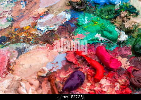 The frame plan of a palette of oil paints of various colors Stock Photo