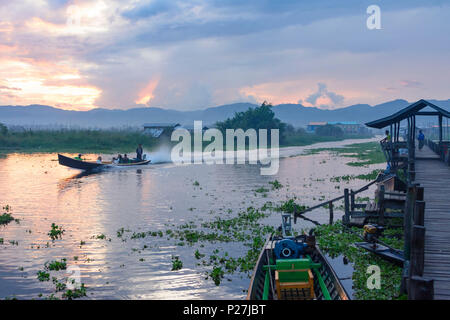 Maing Thauk, wooden bridge into Inle Lake, boat, Inle Lake, Shan State, Myanmar (Burma) Stock Photo