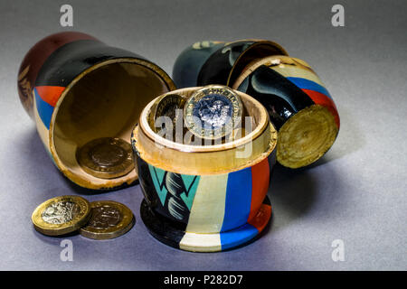 Political and financial concept pictures Modern A matryoshka doll (russian doll) with money inside Stock Photo