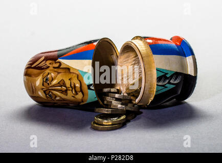 Political and financial concept pictures Modern A matryoshka doll (russian doll) with money inside Stock Photo