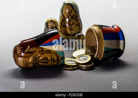 Political and financial concept pictures Modern A matryoshka doll (russian doll) with money inside Stock Photo