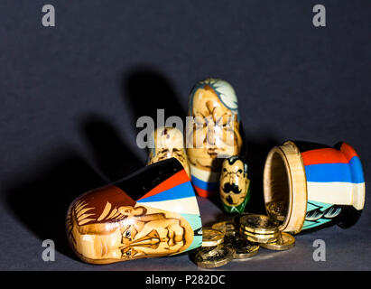 Political and financial concept pictures Modern A matryoshka doll (russian doll) with money inside Stock Photo