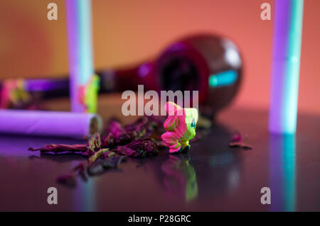 Miniature hazmat team inspects hazardous tobacco products Stock Photo