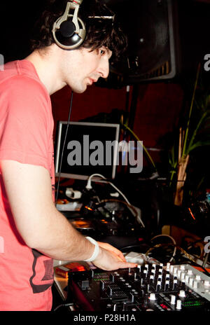 Dj playing disco house progressive music at the night club Stock Photo