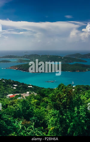 Aerial, vertical view on the turquoise sea and green hills around. Stock Photo