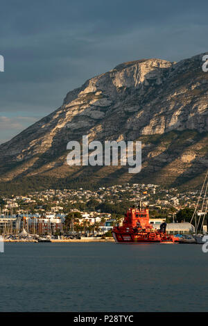 Boats and sailboats at the harbour of Denia and Montgo mountain in the background, Denia, Alicante province, Valencia Community, Spain Stock Photo