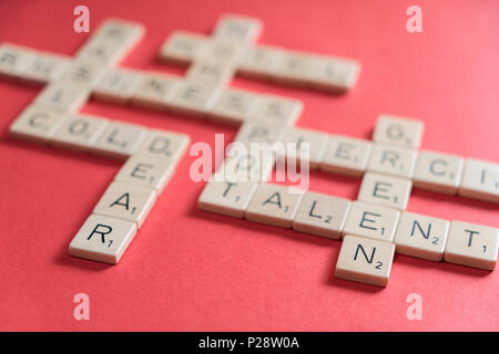 playing scrabble on a red table Stock Photo