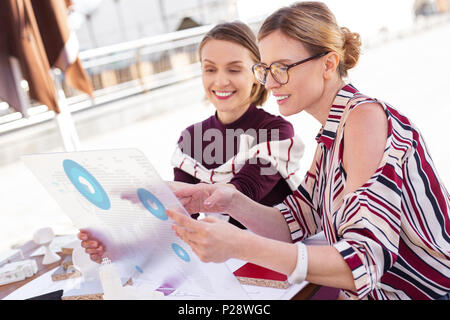 Two creative interior designers looking at apartment scheme Stock Photo