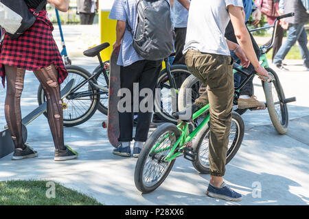 Group of teenagers with bicycles in the Park Stock Photo