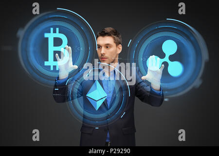 businessman with cryptocurrency holograms Stock Photo