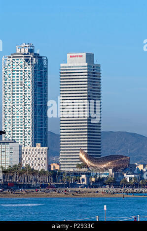 Barcelona, Spain - March 27, 2015: View on the beach and buildings in Port Olympic. Stock Photo