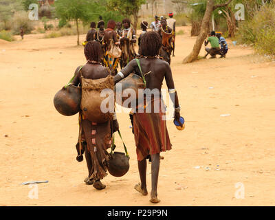 Local Ethiopian people coming back from the market from the Turmi village in the Omo valley in Ethiopia Stock Photo