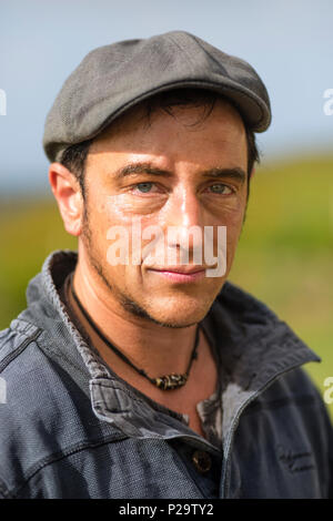 Israeli man wearing flat cap and casual clothes Stock Photo
