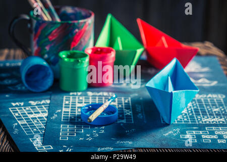 Closeup of battleship paper game with blue and red ships Stock Photo