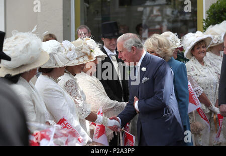 The Prince of Wales and the Duchess of Cornwall meet people dressed in period costume during a visit to the English Market in Cork as part of their tour of the Republic of Ireland. Stock Photo