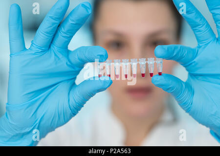 Young woman with genetic research in the laboratory research of cancer diseases Stock Photo