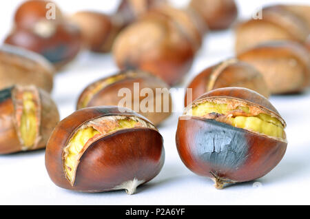 Delicious roasted chestnuts / white background