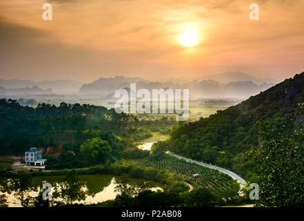 Idyllic sunset over Chinese rice fields and nature on Guangxi province Stock Photo