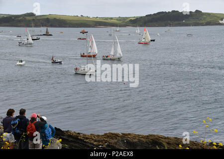 Falmouth, Cornwall, UK. 14th June 2018. Competitors line up for the start  of the SITraN Challenge Race to Les Sables d’Olonne, France, from where the Golden Globe race will start. The race was started by a Sir Robin Knox Johnstone from his boat Sulhaili, after a week of celibrations in Falmouth. Seen here from Pendennis point looking towards St Mawes Credit: Simon Maycock/Alamy Live News Stock Photo