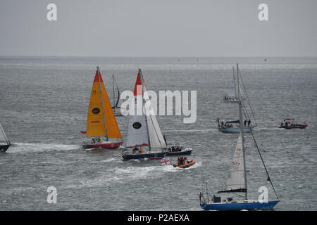 Falmouth, Cornwall, UK. 14th June 2018. Competitors line up for the start  of the SITraN Challenge Race to Les Sables d’Olonne, France, from where the Golden Globe race will start. The race was started by a Sir Robin Knox Johnstone from his boat Sulhaili, after a week of celibrations in Falmouth. Credit: Simon Maycock/Alamy Live News Stock Photo