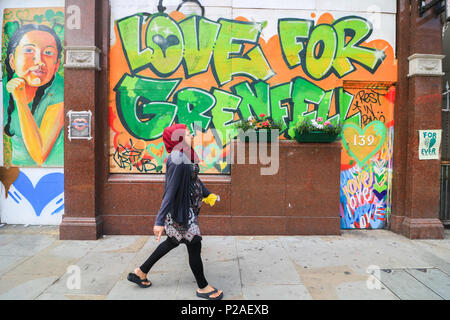 London UK. 14th June 2018.  One Year anniversary after the fire  in West London which claimed the lives of 72 residents in the tower block.  A minute's silence will be observed nationally at midday to remember the victims of the Grenfell fire on 14 June 2017. Credit: amer ghazzal/Alamy Live News Stock Photo